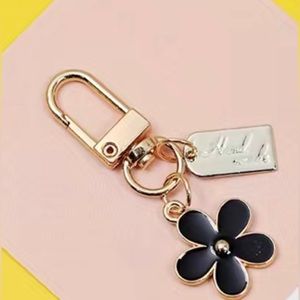 NEW! Small black flower pendant bag charm keychain